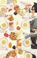 top view of modern multiethnic muslim family having a Ramadan feast photo