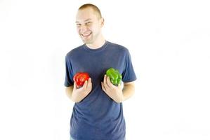 happy couple holding peppers with head photo