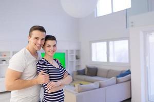 couple hugging in their new home photo