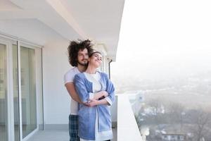 Couple hugging on the balcony photo