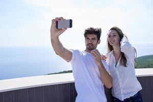 young couple making selfie together photo