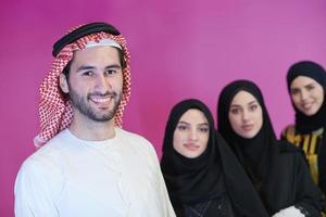 portrait of young muslim people isolated on pink photo