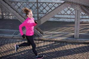 sporty woman jogging on morning photo