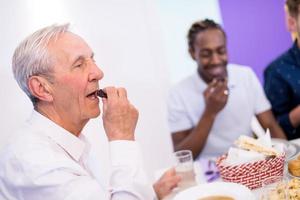 modern muslim grandfather eating dates photo