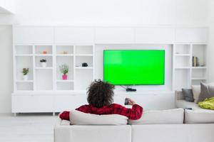 young man in bathrobe enjoying free time photo