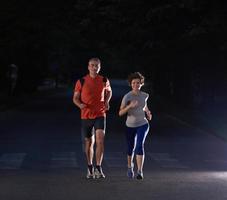 couple jogging at early morning photo