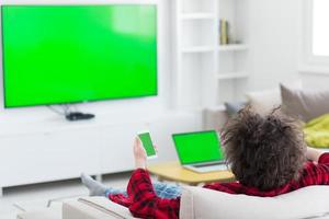 young man in bathrobe enjoying free time photo