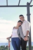 couple relaxing on balcony photo