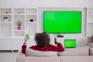 young man in bathrobe enjoying free time photo