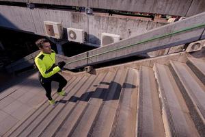 man jogging on steps photo