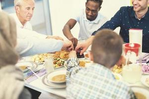 modern multiethnic muslim family sharing a bowl of dates photo
