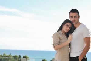 couple relaxing on balcony photo