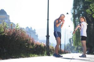 jogging couple planning running route  and setting music photo