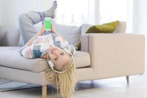 girl enjoying music through headphones photo