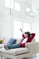 young man in bathrobe enjoying free time photo