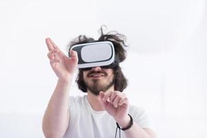 Man using headset of virtual reality photo