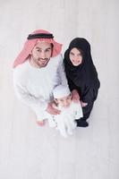 portrait of young happy arabian muslim family top view photo