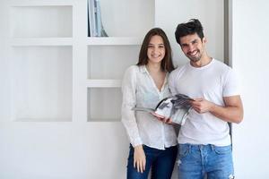 relaxed young couple at home staircase photo