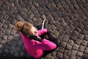 woman  stretching before morning jogging photo