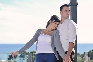 couple relaxing on balcony photo