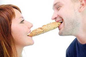 happy couple eating croissant photo