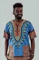 Portrait of a handsome African black man in traditional Islamic Sudan fashion clothes. photo