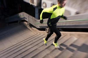 man jogging on steps photo