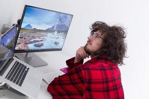 graphic designer in bathrobe working at home photo