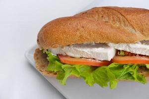 sandwich on a white surface photo