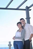 couple relaxing on balcony photo