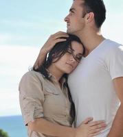 couple relaxing on balcony photo