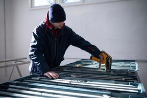 team of mining  workers measuring drilled rock core photo