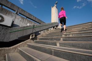 woman jogging on  steps photo