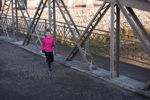 sporty woman jogging on morning photo