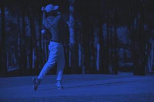 golf player hitting long shot photo