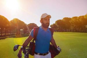 handsome middle eastern golf player at the course photo