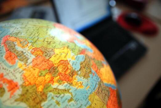 Teamwok concept with hands on globe photo