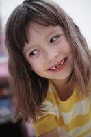 cute little girl at home painting with hands photo