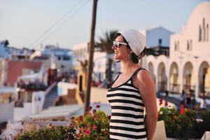 Greek woman on the streets of Oia, Santorini, Greece photo