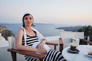 Greek woman on the streets of Oia, Santorini, Greece photo