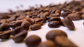 f coffee on a white table with coffee beans. Stock video footage.