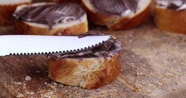 smear on a baguette with chocolate butter photo