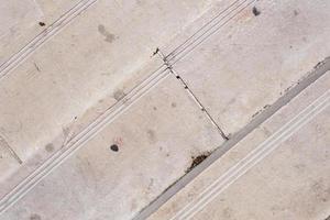 Old weathered marble block staircase, top view, stairs with stains and scratches, steps pattern and texture, stone textured surface. photo