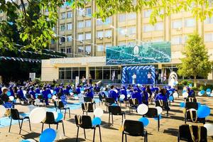 Tbilisi, Georgia,2022 - Graduates sit on graduation. Tbilisi state medical university graduation event. Popular study university in caucasus for expat photo