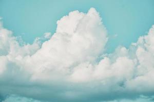 Blue sky blank space background with forming clouds in sunny day outdoors photo