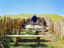 Old traditional bread oven outdoors in village Shuamta. Adjara region photo