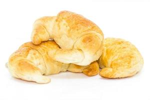 Fresh croissant isolated on white photo