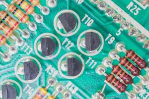 Condensers and Resistor assembly on the circuit board photo