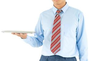 Businessman holding a laptop with clipping path photo