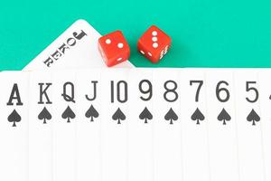 Dices and cards on green casino table photo